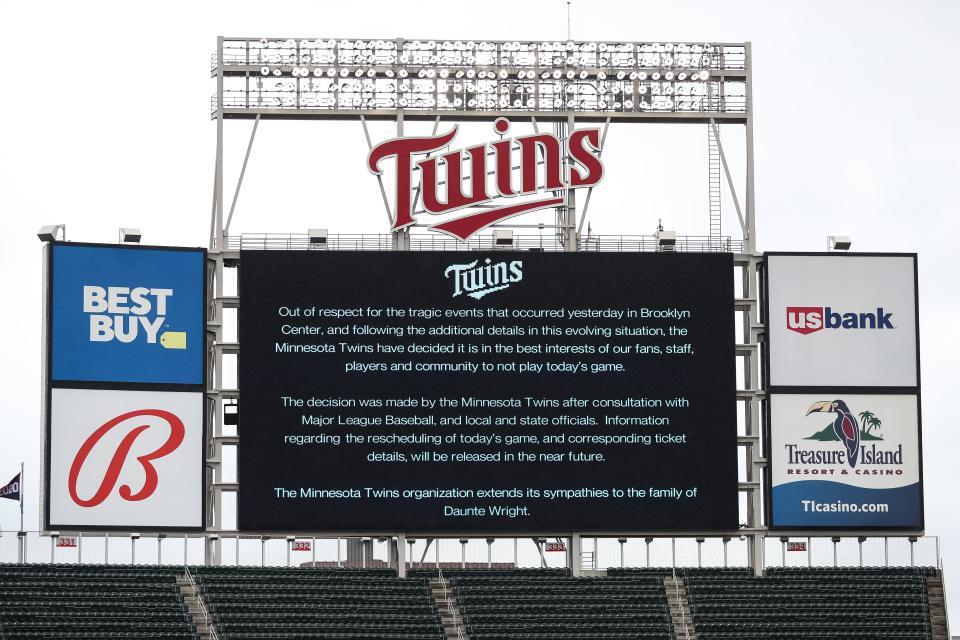 A message on the video board displays a game postponement between the Red Sox and Twins at Target Field.