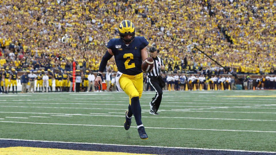 Michigan quarterback Shea Patterson (2) scores on a two-yard touchdown run in the first half of an NCAA college football game against Rutgers in Ann Arbor, Mich., Saturday, Sept. 28, 2019. (AP Photo/Paul Sancya)