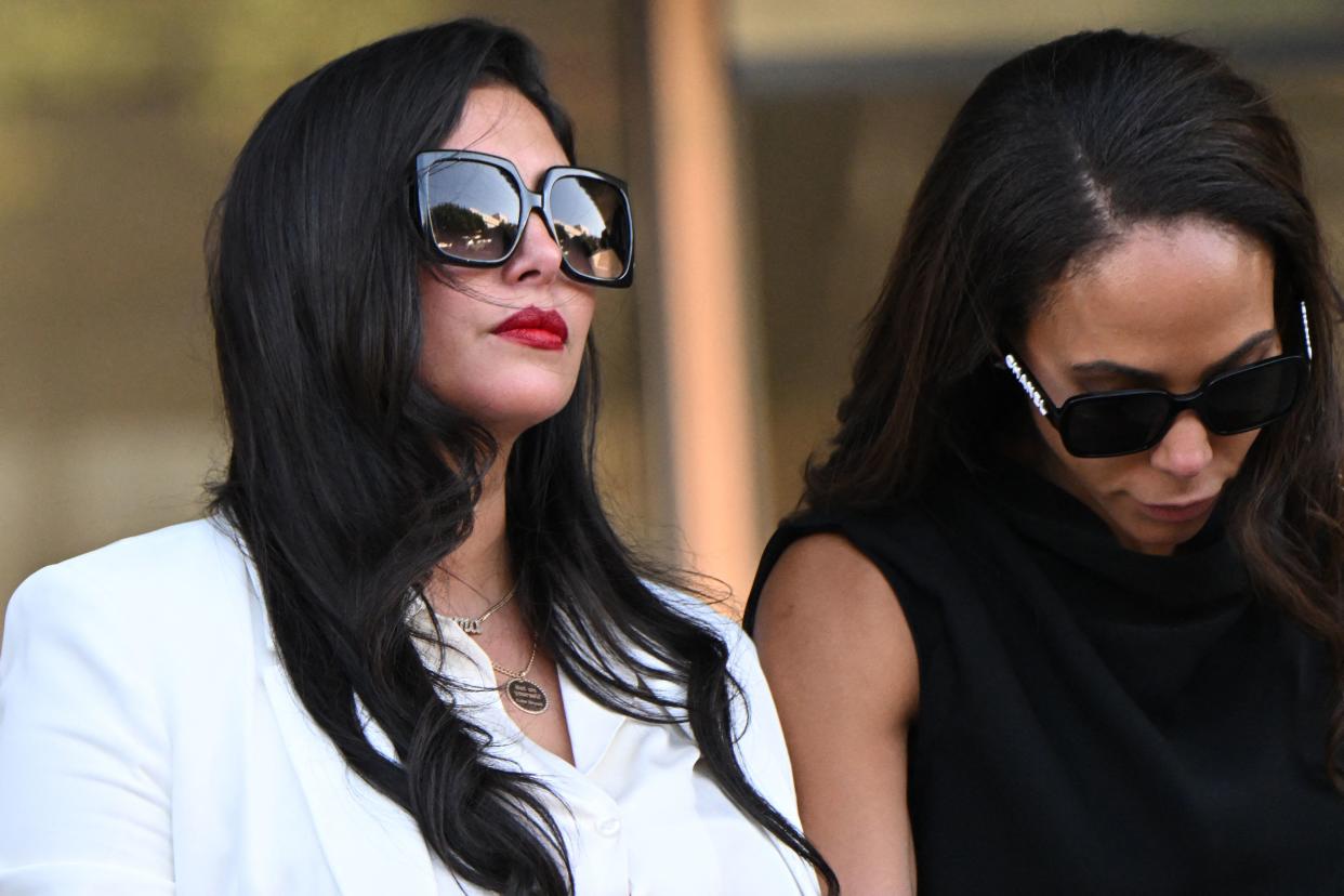 Vanessa Bryant (L), wife of the late Los Angeles Lakers basketball player Kobe Bryant, and close friend Sydney Leroux (R) depart the court house in Los Angeles, California, on August 24, 2022, after a verdict was reached in Bryant's federal negligence lawsuit against Los Angeles County. - A jury ordered Los Angeles County to pay $31 million in damages Wednesday over graphic photos taken by sheriff's deputies and firefighters of the helicopter crash that killed basketball star Kobe Bryant. (Photo by Patrick T. FALLON / AFP) (Photo by PATRICK T. FALLON/AFP via Getty Images)