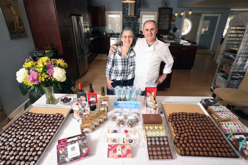 Rockhead Chocolates owner Elizabeth McConville Poussier and her husband chief chocolatier Jean-Marc Poussier make chocolate in their home kitchen in Easton on Monday, March 27, 2023.