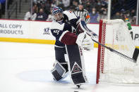 Colorado Avalanche goaltender Pavel Francouz clears the puck in overtime of an NHL hockey game against the Minnesota Wild, Monday, Jan. 17, 2022, in Denver. (AP Photo/David Zalubowski)