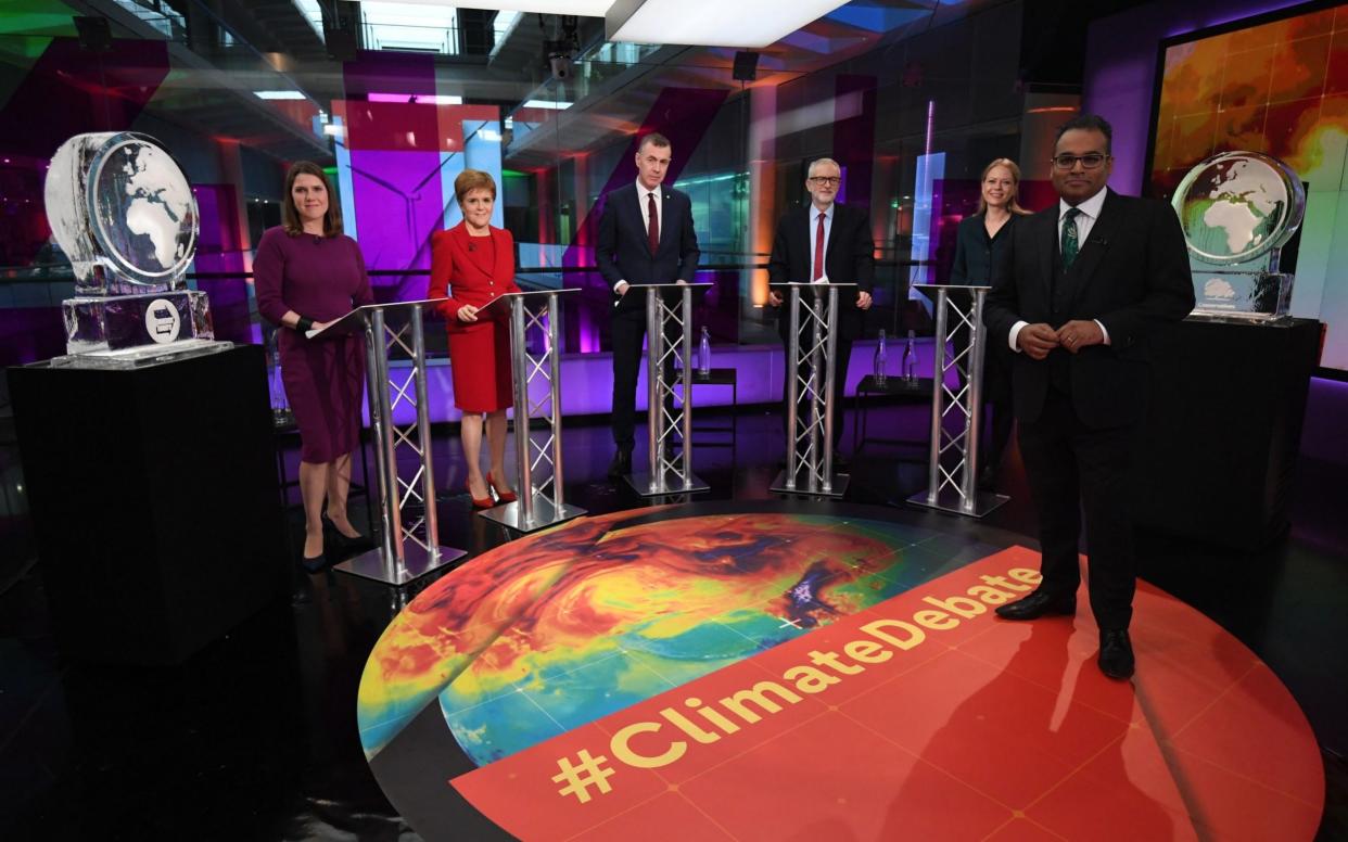 Channel 4 presenter Krishnan Guru-Murthy, right, with (from left to right) Liberal Democrat leader Jo Swinson, SNP leader Nicola Sturgeon, Plaid Cymru leader Adam Price, Labour leader Jeremy Corbyn and Green Party Co-Leader Sian Berry, standing next to ice sculptures representing the Brexit Party and Conservative Party - PA