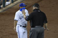 Toronto Blue Jays manager Charlie Montoyo, left, talks with first base umpire Joe West, right, after Rowdy Tellez was ejected during the tenth inning of a baseball game against the Washington Nationals, Wednesday, July 29, 2020, in Washington. The Nationals won 4-0 in extra innings. (AP Photo/Nick Wass)