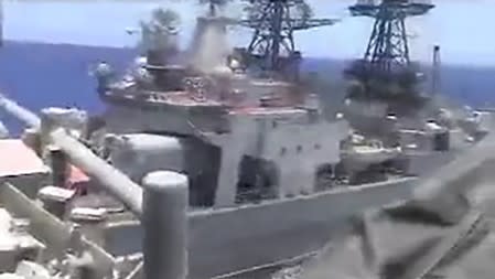 Russian naval destroyer Udaloy makes a maneuver against the USS Chancellorsville