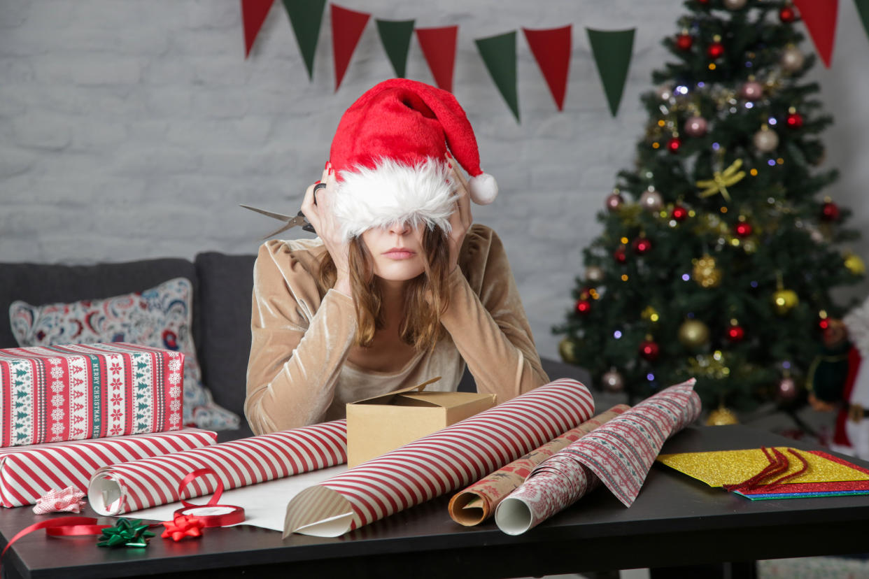 Woman who appears to be suffering from festive fatigue. (Getty Images)