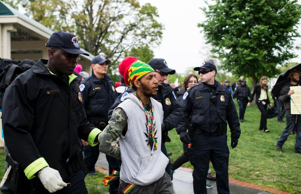 U.S. Capitol Police arrest several DCMJ.org marijuana advocates after they smoked marijuana in front of the U.S. Capitol during their protest on Monday, April 24, 2017. (Photo: Bill Clark/CQ Roll Call) 