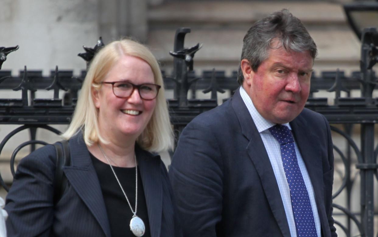 David and Katherine Harvey walking to London's High Court where they are being sued by neighbour Maria Serra