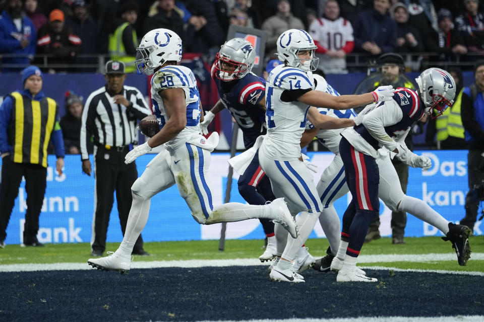 Indianapolis Colts running back Jonathan Taylor (28) carries for a touchdown in the first half of an NFL football game against the New England Patriots in Frankfurt, Germany Sunday, Nov. 12, 2023. (AP Photo/Martin Meissner)