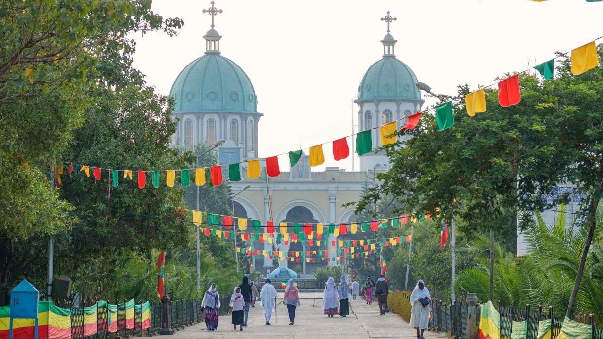 People walk near the Medhane Alem Cathedral during the Timkat Festival, an annual Orthodox Christian celebration of the Epiphany, in Addis Ababa, Ethiopia.