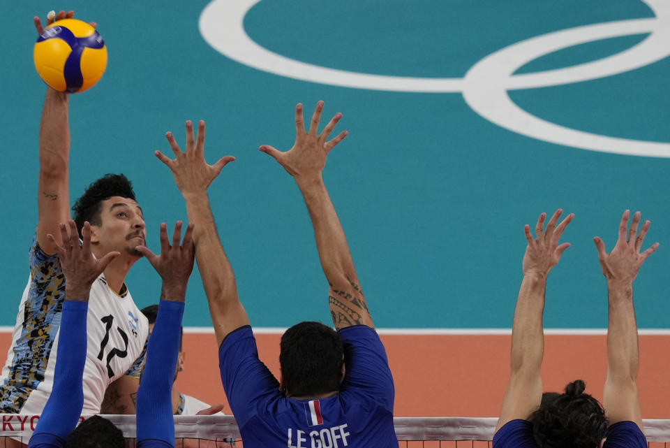 Argentina's Bruno Lima hits a ball during a men's volleyball semifinal match against France, at the 2020 Summer Olympics, Thursday, Aug. 5, 2021, in Tokyo, Japan. (AP Photo/Frank Augstein)