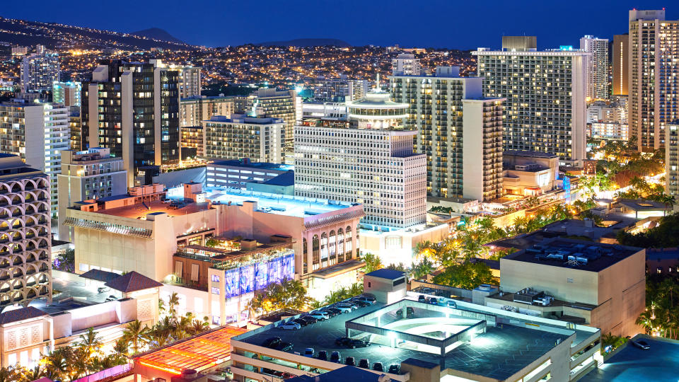 Aerial view of Honolulu cityscape at night, Hawaii, USA.