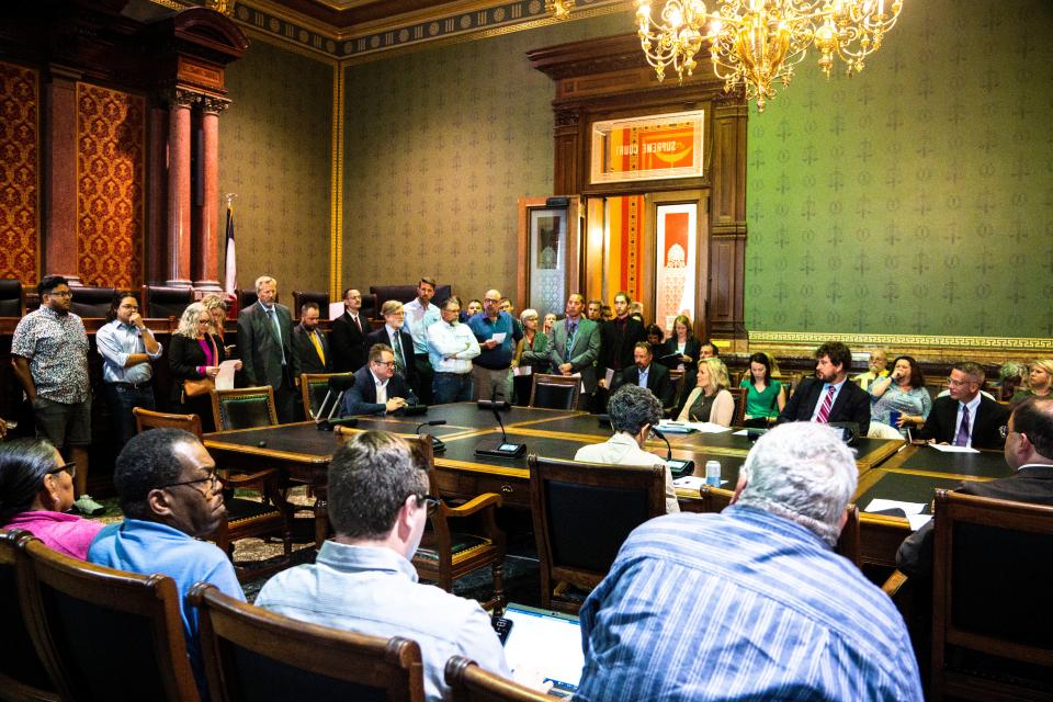 In-person speakers line up for their turn during a hearing with the state Boards and Commissions Review Committee at the Iowa State Capitol on Wednesday, September 6, 2023 in Des Moines.