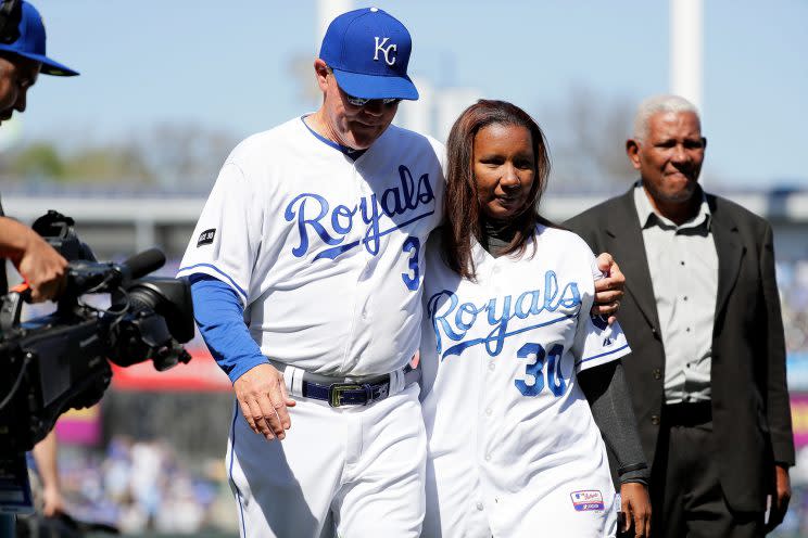 Kansas City manager Ned Yost walks off the field with his arm around Marisol Hernandez, mother of deceased pitcher Yordano Ventura #30 prior to the Royals 2017 home opener against the Oakland Athletics. (Getty)