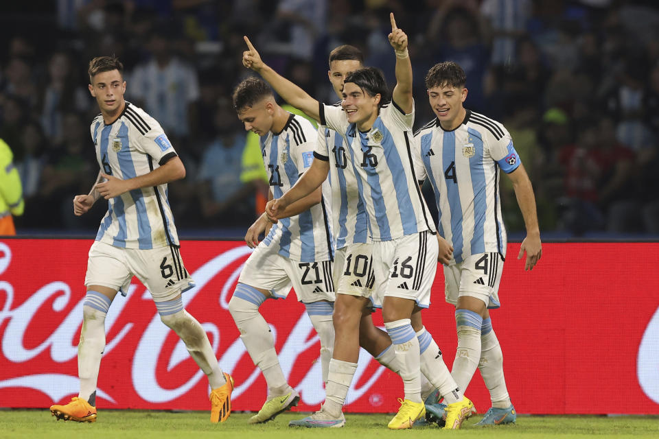 Argentina's Luka Romero (16) celebrates scoring his side's 2nd goal against Guatemala during a FIFA U-20 World Cup Group A soccer match at the Madre De Ciudades stadium in Santiago del Estero, Argentina, Tuesday, May 23, 2023. (AP Photo/Nicolas Aguilera)