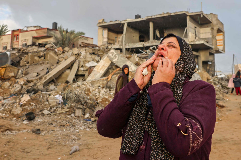 A Palestinian woman reacts as people inspect the damage following Israeli strikes on Rafah, in the southern Gaza Strip, on Nov. 20, 2023. (Mohammed Abed / AFP - Getty Images)