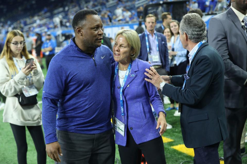 Former Detroit Lions running back Barry Sanders talks with Lions owner Sheila Hamp before the game against the Seattle Seahawks at Ford Field, Sunday, Sept. 17, 2023.