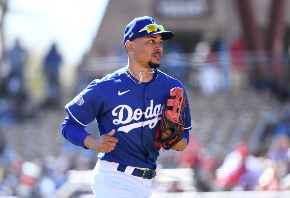 GLENDALE, ARIZONA - FEBRUARY 26: Mookie Betts #50 of the Los Angeles Dodgers runs back to the dugout from right field during a spring training game against the Los Angeles Angels at Camelback Ranch on February 26, 2020 in Glendale, Arizona. (Photo by Norm Hall/Getty Images)