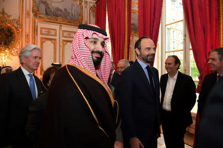 French Prime Minister Edouard Philippe (R) escorts Saudi Arabia's Crown Prince Mohammed bin Salman upon his arrival at the Hotel de Matignon in Paris, France, April 9, 2018. Eric Feferberg/Pool via Reuters