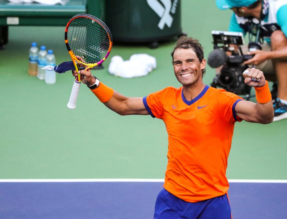 Rafael Nadal of Spain smiles to fans after defeating Nick Kyrgios of Australia during the quarterfinals at the BNP Paribas Open at the Indian Wells Tennis Garden in Indian Wells, Calif., Thursday, March 17, 2022. 