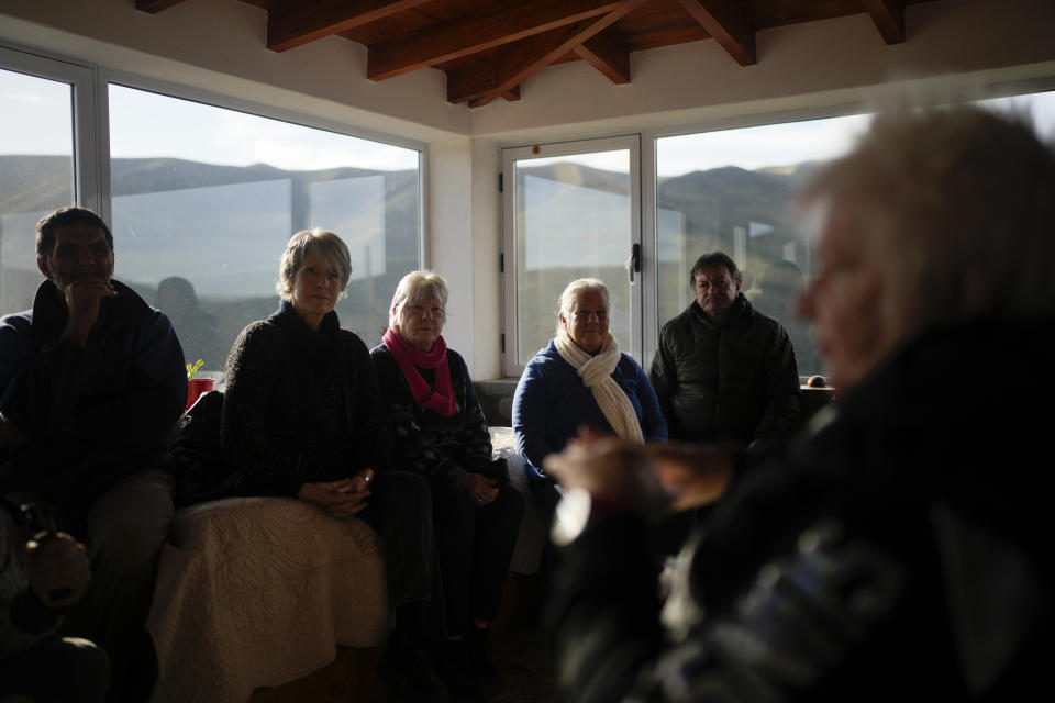 Miryam Dietrich talks to followers at her home in Capilla del Monte, Cordoba, Argentina, Tuesday, July 18, 2023. Once Catholic, Dietrich now believes in angels and aliens. In the pope’s homeland of Argentina, Catholics have been renouncing the faith and joining the growing ranks of the religiously unaffiliated. Commonly known as the “nones,” they describe themselves as atheists, agnostics, spiritual but not religious, or simply: “nothing in particular.” (AP Photo/Natacha Pisarenko)