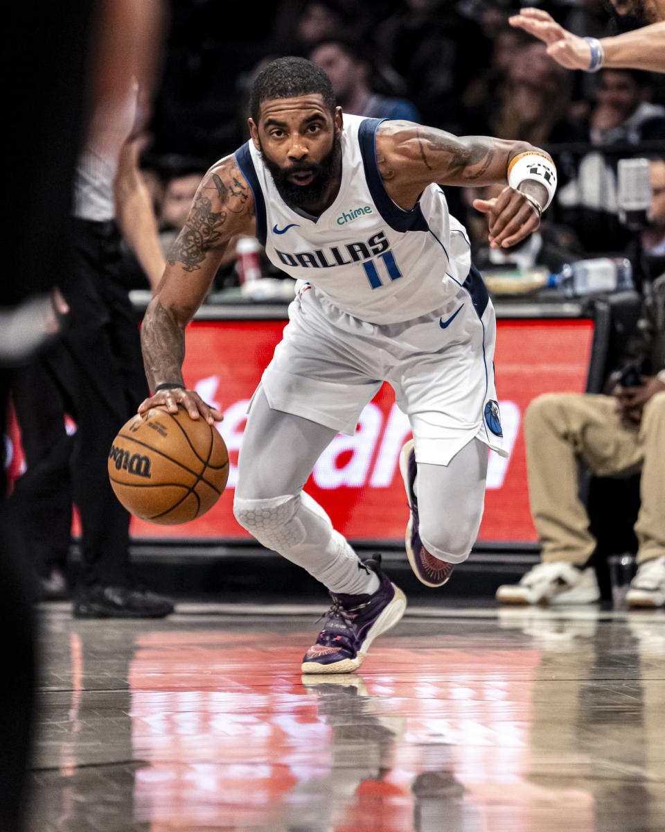 Dallas Mavericks guard Kyrie Irving drives to the basket during the first half of the team's NBA basketball game against the Brooklyn Nets in New York, Tuesday, Feb. 6, 2024. (AP Photo/Peter K. Afriyie)