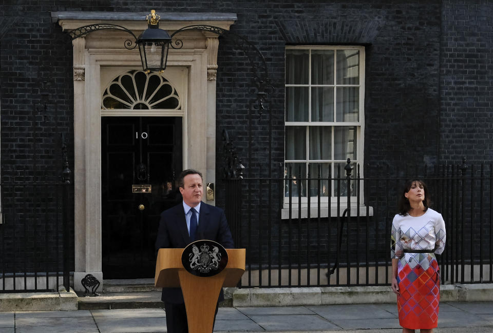 FILE - In this Friday, June 24, 2016 file photo, British Prime Minister David Cameron speaks outside 10 Downing Street, London as his wife Samantha looks on. Cameron announced his plan to step down, a day after Britain voted to leave the European Union in a referendum. On Friday, May 24, 2019 announced she would resign as party leader, effective June 7, because of her inability to deliver on a referendum to leave the European Union. May has joined the ranks of Conservative prime ministers whose time in office has been overwhelmed — and cut short — by the issue of Europe. (AP Photo/Alastair Grant, File)