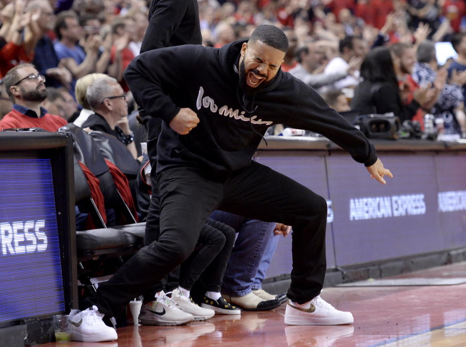 Drake reacts to a 3-point basket during the second half of Game 6 of the NBA basketball playoffs Eastern Conference finals between the Toronto Raptors and the Milwaukee Bucks on Saturday, May 25, 2019, in Toronto. (Nathan Denette/The Canadian Press via AP)