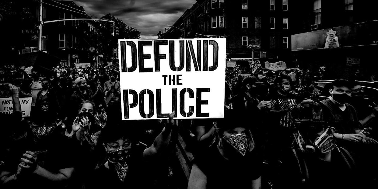 As demonstrations spotlighting racial injustice and police brutality continue, the chorus is growing to "defund" law enforcement agencies. This sign was held aloft in New York City. (Photo: Photo Illustration: HuffPost Visuals; Photo: Erik McGregor/LightRocket via Getty Images)