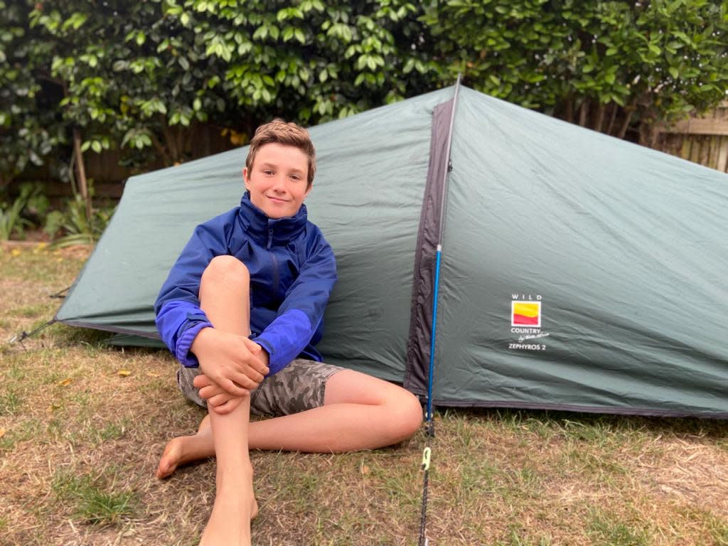 Max Woosey, aged 11, camping out in his tent in his garden in Braunton, Devon. (SWNS)