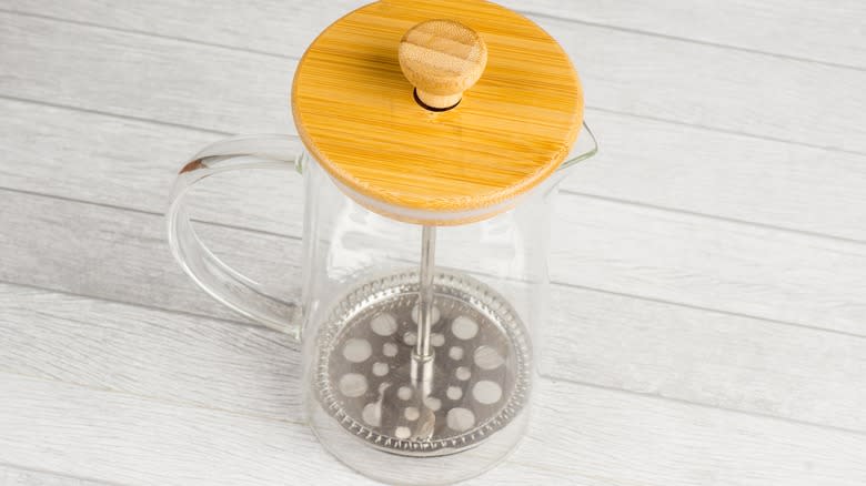 woman using French press