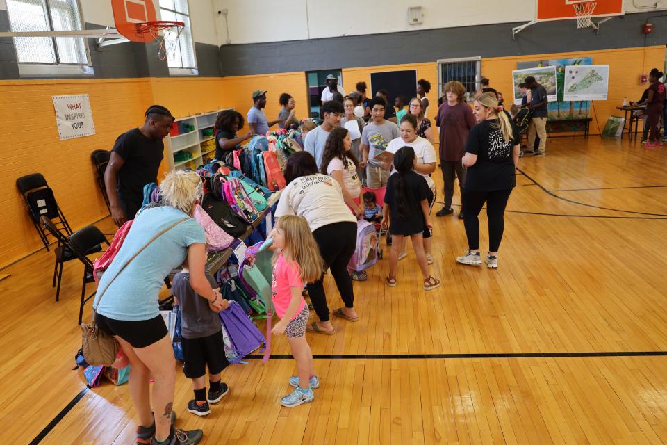 New backpacks and school supplies for the kids at the Western Heights community’s back-to-school block party on Aug. 1, 2023.