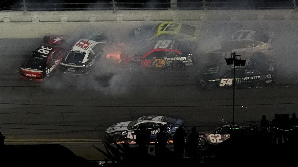 Todd Gilliland (38), Brad Keselowski (6), Martin Truex Jr. (19), Ryan Blaney (12), Denny Hamlin (11), and Ty Gibbs (54) crash during the NASCAR Daytona 500 auto race Monday, Feb. 19, 2024, at Daytona International Speedway in Daytona Beach, Fla. (AP Photo/Chris O'Meara)