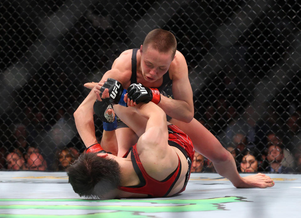 Nov 6, 2021; New York, NY, USA; Rose Namajunas (red gloves) competes against Zhang Weili (blue gloves) during UFC 268 at Madison Square Garden. Mandatory Credit: Ed Mulholland-USA TODAY Sports