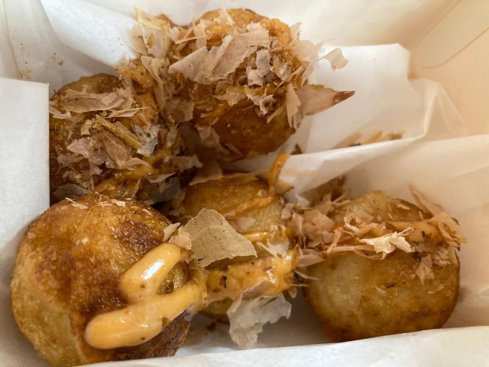 Takoyaki, fried balls of vegetables and octopus, at Crispy Burger in Burlington on Feb. 2, 2024.