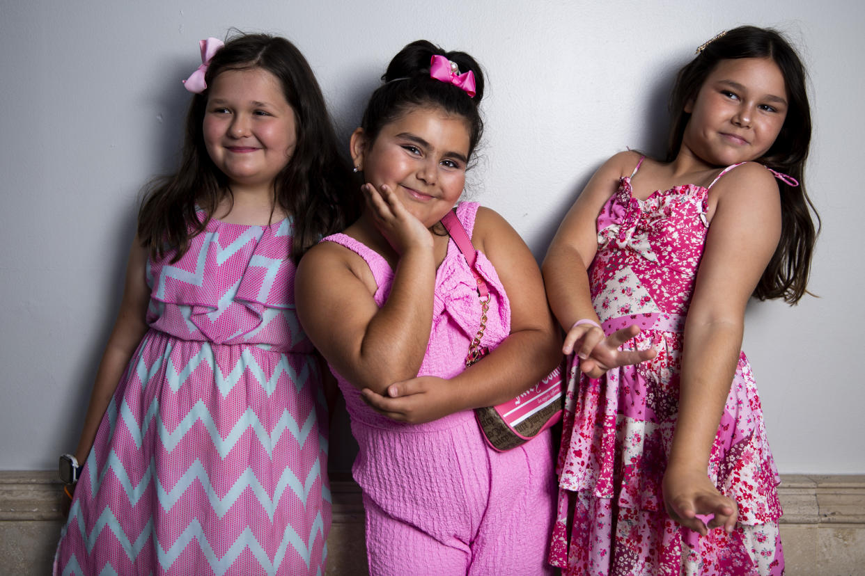 From left, Sophie Davidoff, Ayan Babayeva and Mia Ilyaich, all 9, wore pink to see 