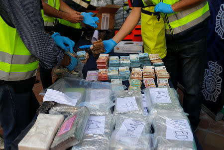 Police display a portion of the six tonnes of cocaine, money and other material which was seized during a drug bust at an industrial estate at the police headquarters in Malaga, Spain, October 25, 2018. REUTERS/Jon Nazca