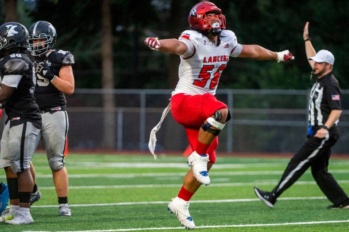 Kennedy Catholic defensive lineman Ish Taliauli celebrates after sacking Kentwood quarterback Anthony Tucker in the second quarter of a 4A NPSL game on Thursday, Sept. 15, 2022, at French Field in Kent, Wash.