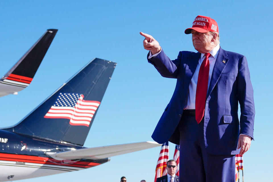 Donald Trump points during a rally (Paul Sancya / AP)