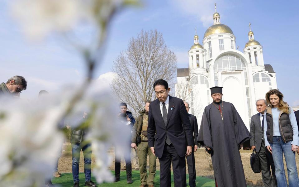 Japanese Prime Minister Fumio Kishida offers prayers at a church in Bucha - Iori Sagisawa/Kyodo News