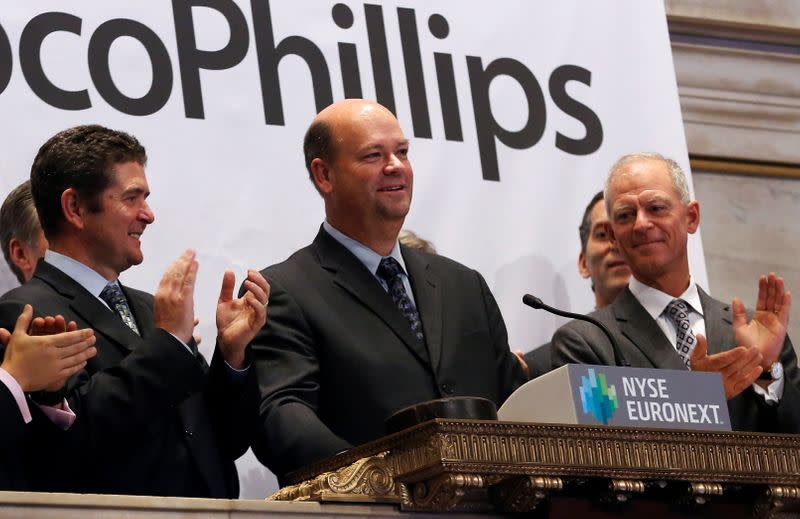 FILE PHOTO: ConocoPhillips Chairman and CEO Lance rings the closing bell at the New York Stock Exchange