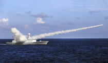 FILE - In this July 8, 2016, file photo released by Xinhua News Agency, Chinese missile frigate Yuncheng launches an anti-ship missile during a military exercise in the waters near south China's Hainan Island and Paracel Islands. Ahead of the 2021 annual Congress meetings, China is continuing its military buildup and recently passed a law authorizing its coast guard to use force to remove foreign presences in what it considers Chinese waters and islands. (Zha Chunming/Xinhua via AP, File)