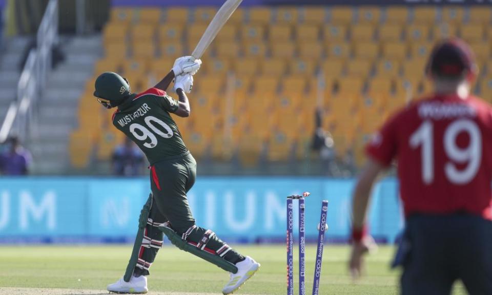 Bangladesh’s Mustafizur Rahman is bowled by Tymal Mills.