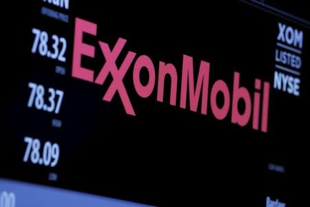 The logo of Exxon Mobil Corporation is shown on a monitor above the floor of the New York Stock Exchange in New York, December 30, 2015. REUTERS/Lucas Jackson -