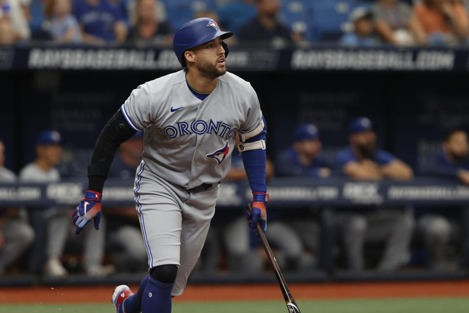 Toronto Blue Jays' George Springer watches the ball after hitting a two-run home run against the Tampa Bay Rays during the third inning of a baseball game Sunday, Sept. 25, 2022, in St. Petersburg, Fla. (AP Photo/Scott Audette)