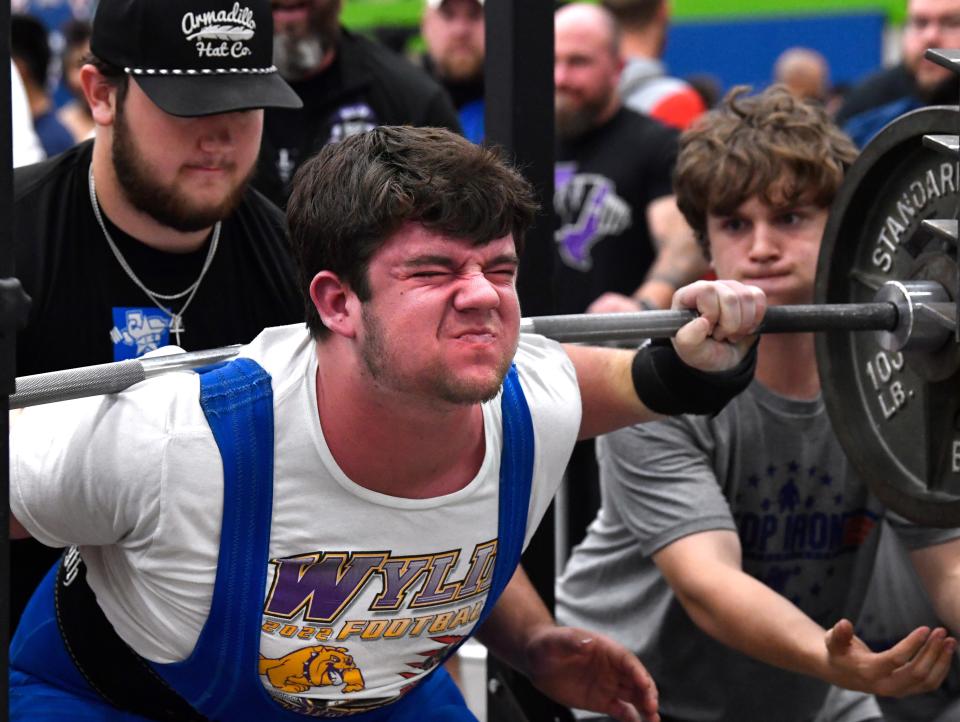 Wylie’s Cayden Clay attempts a 720-pound squat Saturday.