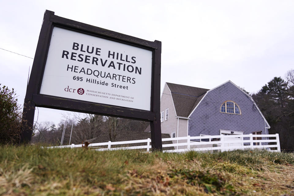 A sign marks a trailhead and headquarters at the Blue Hills Reservation, Wednesday, Dec. 28, 2022, in Milton, Mass. First Day Hikes, that started in Massachusetts in 1992, have become a nationwide phenomenon. Thousands of people are expected to take part in First Day Hikes at hundreds of state parks in all 50 states this New Year's Day. (AP Photo/Charles Krupa)