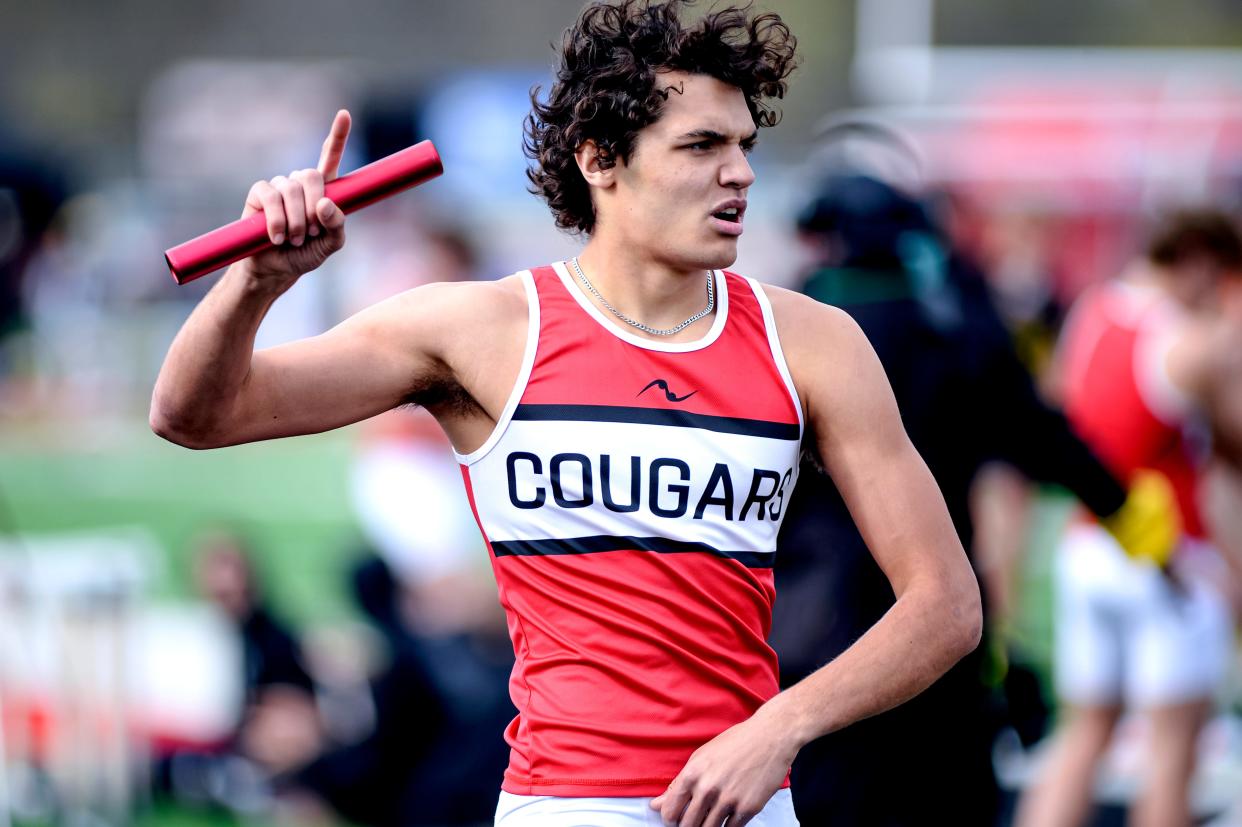 Crestview's Logan Friges celebrates a relay win during the 2024 Forest Pruner Invite at Crestview High School on Friday.