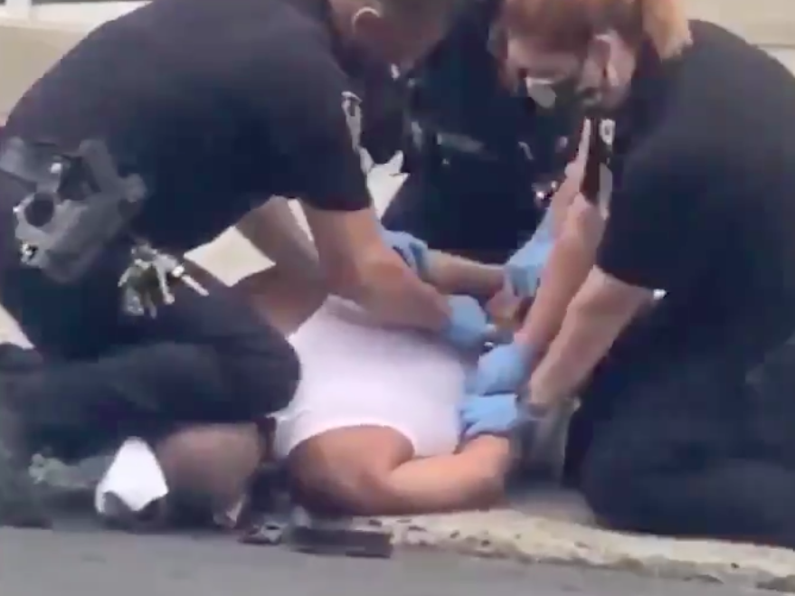 A police officer kneels on a man who was reportedly behaving "erratically" outside a hospital in Allentown, Pennsylvania: Twitter