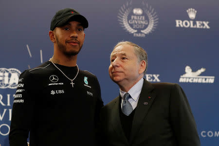 Mercedes' Formula One driver Lewis Hamilton (L) and Jean Todt, Federation Internationale de l'Automobile (FIA) President attend the FIA Champions news conference for FIA Prize Giving 2017 in Paris, France December 8, 2017. REUTERS/Gonzalo Fuentes