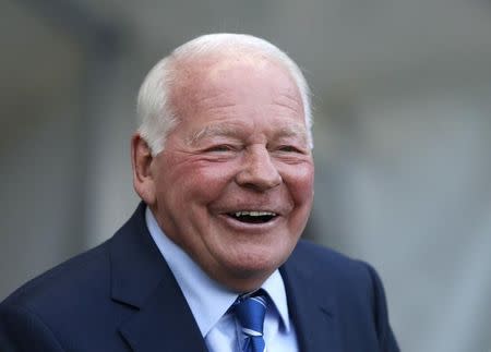 Wigan Athletic's chairman and owner Dave Whelan smiles before his team's English FA Cup quarter final soccer match against Manchester City at the Etihad stadium in Manchester, northern England, March 9, 2014. REUTERS/Phil Noble